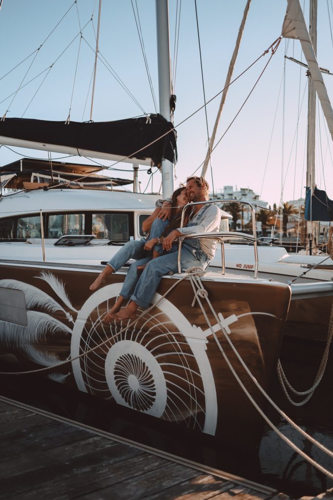 http://People%20hugging%20sitting%20onboard%20of%20Lagoon%20380%20S2